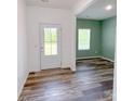 Entryway with stylish wood-look flooring and views of the adjacent room at 1542 Antioch Dr, Conover, NC 28613