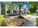 Charming two-story home with brick and vinyl siding, a manicured lawn and inviting front porch at 2316 Savannah Hills Dr, Matthews, NC 28105