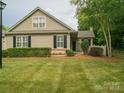 Beautiful single-Gathering home with a well-maintained lawn and a welcoming entrance at 2656 Polo Club Blvd, Matthews, NC 28105