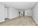 Spacious living area with ample natural light and modern flooring at 3853 Carl Parmer Dr, Harrisburg, NC 28075