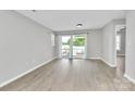 Bright living room with sliding glass doors, offering a seamless indoor-outdoor flow at 3853 Carl Parmer Dr, Harrisburg, NC 28075