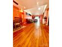 Beautiful living room with hardwood floors, comfortable seating, and bright lighting at 7333 Rosehall Dr, Charlotte, NC 28227
