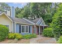 Charming two-story home with blue siding, landscaped front yard, and a cozy porch at 9136 Four Mile Creek Rd, Charlotte, NC 28277