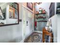 Welcoming entryway with decorative shelves, fresh paint, and classic front door at 106 Guffey Rd, Cherryville, NC 28021