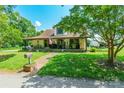 Inviting home exterior with a brick path, covered porch, and well-maintained lawn at 106 Guffey Rd, Cherryville, NC 28021