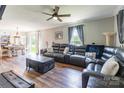 Spacious living room with hardwood floors, a ceiling fan, and a large comfortable sectional at 106 Guffey Rd, Cherryville, NC 28021