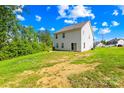 Spacious backyard featuring a gentle slope, ideal for outdoor activities, surrounded by lush greenery and trees at 107 Frank Burns Way, Kings Mountain, NC 28086