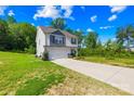 Inviting two-story home with a well manicured front lawn, long driveway and a two car garage at 107 Frank Burns Way, Kings Mountain, NC 28086