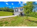 Traditional two-story house boasting a tidy front lawn and a convenient two-car attached garage at 107 Frank Burns Way, Kings Mountain, NC 28086