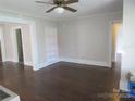 Inviting living room with wood floors, built-in shelving, and neutral paint at 1146 Buffalo St, Shelby, NC 28150