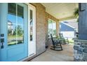 Charming front porch with rocking chairs, perfect for relaxing and enjoying the outdoors at 19012 Beecher Commons Dr, Huntersville, NC 28078