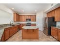 Well-equipped kitchen featuring granite countertops, stainless steel appliances, and a functional center island at 7362 Waterwheel Sw St, Concord, NC 28025