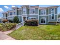 Charming condo with well-maintained lawn, mature shrubs, and stylish architectural details at 17406 Tuscany Ln, Cornelius, NC 28031