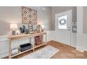 Cozy foyer featuring hardwood floors, stylish decor, and a welcoming atmosphere at 2103 Cantata Ct, Matthews, NC 28105