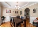 Dining room featuring hardwood floors, coffered ceiling, and an elegant chandelier at 2635 Mahogany Ln, Hickory, NC 28602