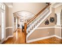 Entryway with hardwood floors and staircase view leading to the dining room at 2635 Mahogany Ln, Hickory, NC 28602