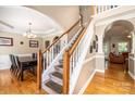 Elegant staircase with wooden handrail and white balusters leading to the second floor at 2635 Mahogany Ln, Hickory, NC 28602