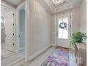 Bright foyer with decorative rug, transom window, and views to other rooms at 3018 Trace Meadow Ct # 125, York, SC 29745