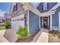 Home's facade showcases stone accents and a welcoming entrance with a decorative wreath at 3018 Trace Meadow Ct # 125, York, SC 29745