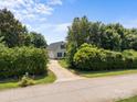 A secluded home surrounded by mature trees and lush greenery, providing a private and tranquil setting at 315 Talon Dr, Salisbury, NC 28147