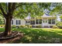 Inviting home with a well-manicured lawn, stone-lined flower beds, and a charming covered front porch at 315 Talon Dr, Salisbury, NC 28147