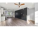 Stylish open-concept living room with wood floors, designer paint and modern fixtures at 405 E Broad St, Salisbury, NC 28144