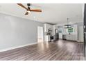 Spacious living room with hardwood floors, ceiling fan, and lots of natural light at 405 E Broad St, Salisbury, NC 28144