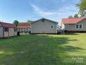 Large grassy backyard with a storage shed at 4303 Grier St, Gastonia, NC 28056
