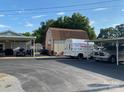 Spacious driveway leads to the garage and auxiliary buildings at 4303 Grier St, Gastonia, NC 28056