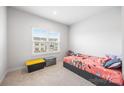 Bright bedroom featuring a window and neutral decor, creating a cozy and inviting space for relaxation and rest at 9921 Oaklawn Nw Blvd, Huntersville, NC 28078