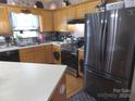 Well-equipped kitchen with stainless steel appliances and wood cabinets at 1609 Indian Springs Nw Dr # 35, Conover, NC 28613