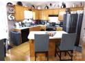 Bright kitchen featuring hardwood floors and stainless steel refrigerator at 1609 Indian Springs Nw Dr # 35, Conover, NC 28613