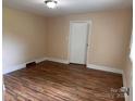 Bedroom with updated flooring, neutral paint, and natural light at 1849 Hilltop Cir, Gastonia, NC 28054