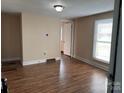 Bright living room featuring new flooring and a large window at 1849 Hilltop Cir, Gastonia, NC 28054