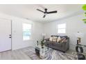 Well-lit living room featuring a modern sofa, neutral walls, and stylish decorations at 1919 Gay St, Statesville, NC 28625