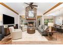Inviting living room featuring a stone fireplace, vaulted ceilings, and hardwood floors at 4033 Hilton Lake Rd, Kannapolis, NC 28083