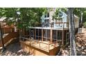 Beautiful home with a large wooden deck and screened in porch surrounded by lush trees at 113 Harbor Ln # 6, Mount Gilead, NC 27306