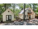 Charming home with a small balcony, lovely trees, a cozy shed, and water views at 113 Harbor Ln # 6, Mount Gilead, NC 27306