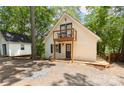 Charming home with a small balcony, lovely trees, and a cozy shed at 113 Harbor Ln # 6, Mount Gilead, NC 27306
