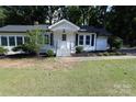 Inviting front entrance with well-manicured landscaping and a cozy porch at 1257 Reese Roach Rd, Rock Hill, SC 29730