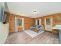 Cozy living room with wood-paneled walls and hardwood flooring, modern furniture and decor at 164 Pleasant Creek Dr, Cleveland, NC 27013