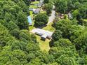 Birds eye view of the home showcasing lush surroundings and a peaceful neighborhood at 222 Laramie Dr, Stanley, NC 28164
