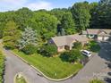 An aerial view showcases this home's manicured lawn, mature trees, with nearby streets and adjacent homes, highlighting its location at 2680 Heavens Ct, Fort Mill, SC 29715