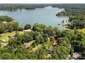 Gorgeous aerial perspective showcases a property nestled amidst lush greenery close to the tranquil waters of Lake Norman at 480 Robinson Rd, Mooresville, NC 28117