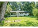 Charming single-story home with brick facade, black shutters and an inviting front yard at 1048 Shenandoah Dr, Gastonia, NC 28052