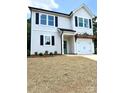 Charming two-story home with a white exterior, black shutters, a covered front porch, and an attached garage at 1683 Interstate View Dr, Gastonia, NC 28052