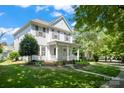 Charming two-story home with a welcoming front porch and lush green lawn at 17514 Harbor Walk Dr, Cornelius, NC 28031