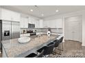 Bright kitchen with a large island, stainless appliances, and ample cabinet space at 4044 Beacon Ave # 152, Monroe, NC 28110