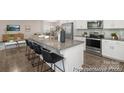 Modern kitchen featuring stainless steel appliances and a spacious island with seating at 4044 Beacon Ave # 152, Monroe, NC 28110