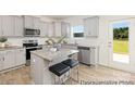 Modern kitchen with stainless steel appliances, granite countertops, and island seating at 6032 Santee River Way # 50, Belmont, NC 28012